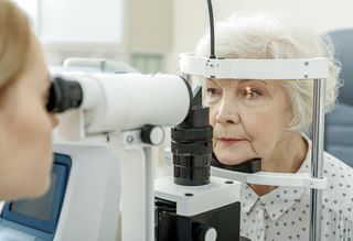 Older person getting their eyes tested