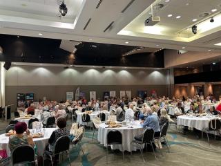 Seated visitors at a Seniors Expo.