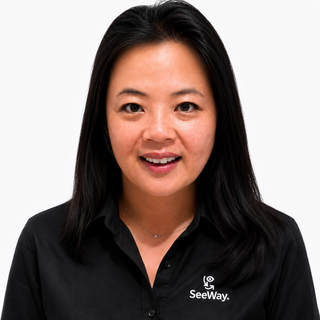 A headshot of Sandra smiling at the camera.