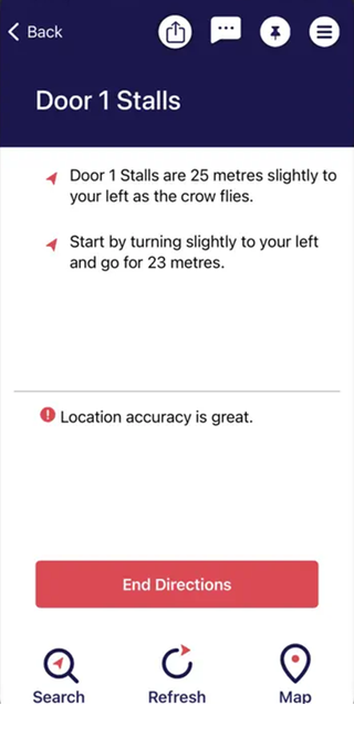 A screenshot of the Bindi Maps app providing directions towards the Door 1 Stalls at a theatre.
