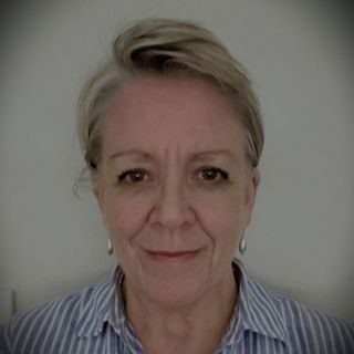 A headshot of Karen Warwick smiling at the camera