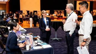 SeeWay representatives speaking with delegates at the congress.