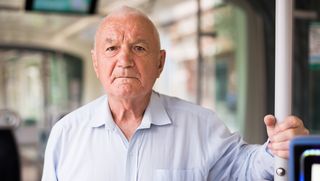 Older person travelling on bus