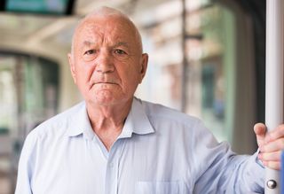 Older person travelling on bus