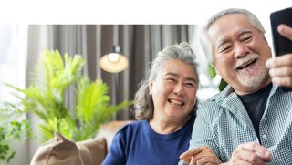 Older couple looking at a phone screen together