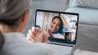 Older woman talking online with psychologist online