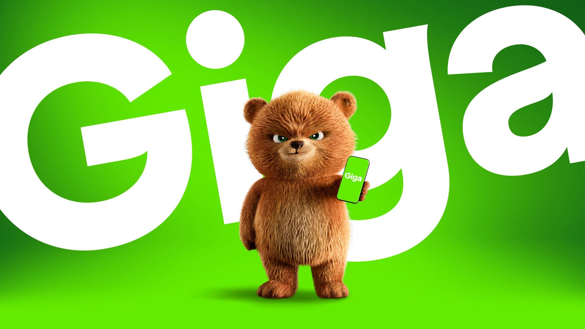 A brown cartoon bear with a stern expression holds a smartphone displaying 'Giga' on a green screen, against a bright green background with large white 'Giga' text.