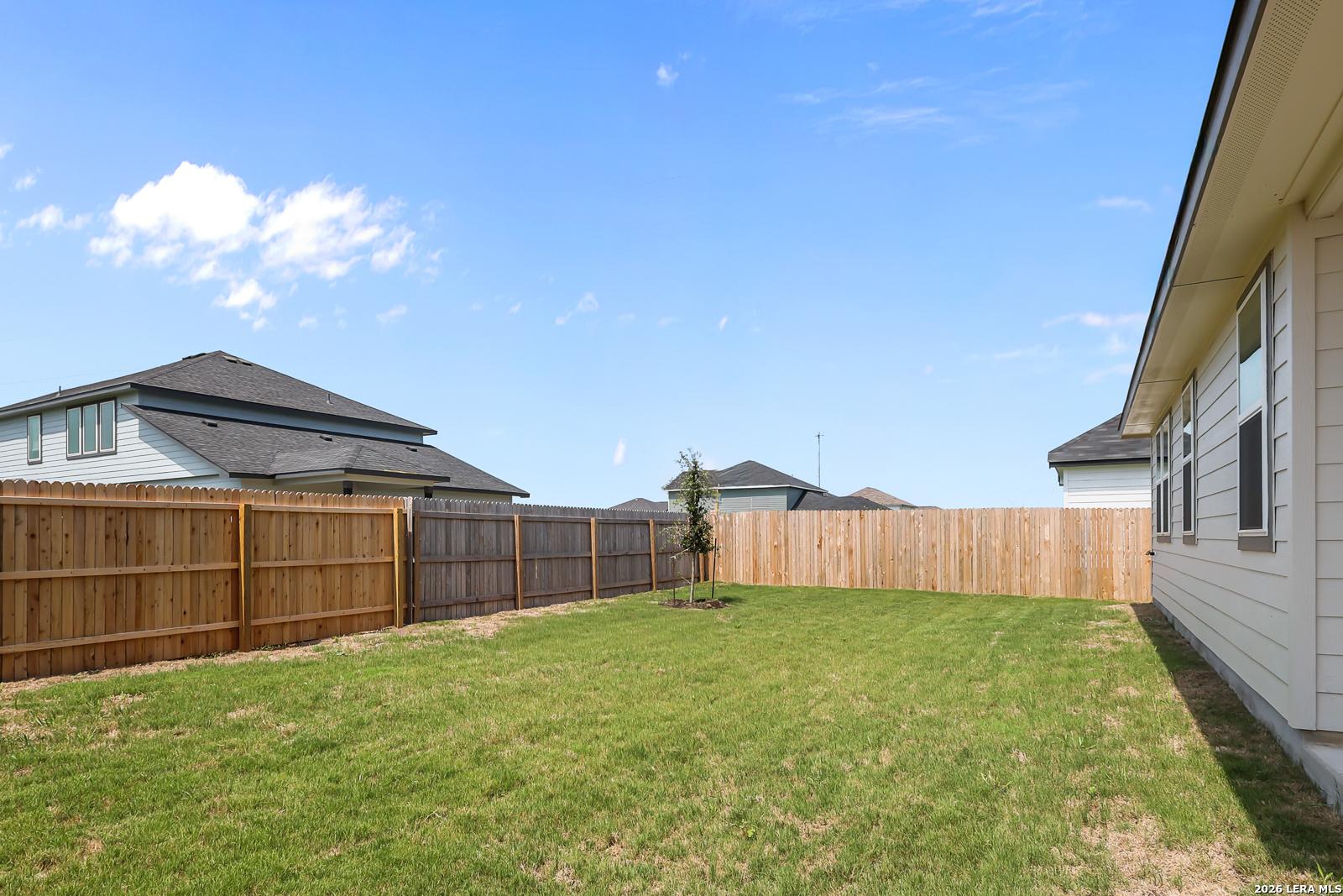Private fenced backyard of The Daphne H floor plan by Davidson Homes in Hannah Heights, Seguin, Texas.