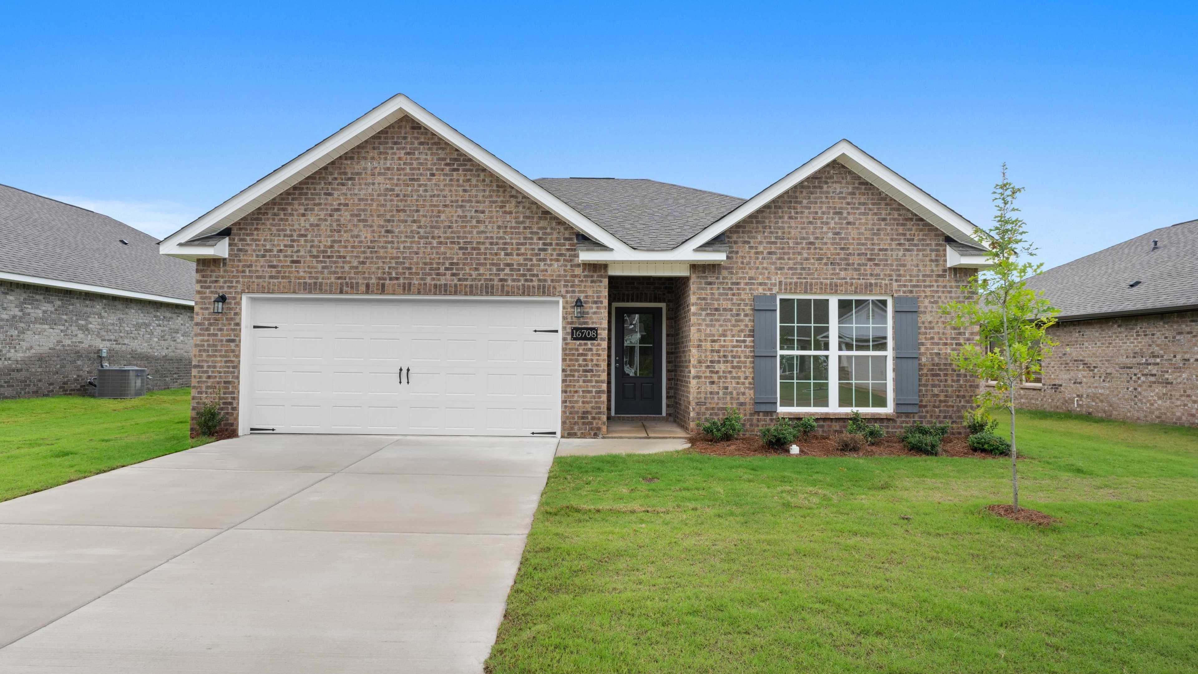 Brick ranch-style home at 16708 Demi Drive open house, Davidson Homes new build with garage, driveway, shutters, and lush green lawn