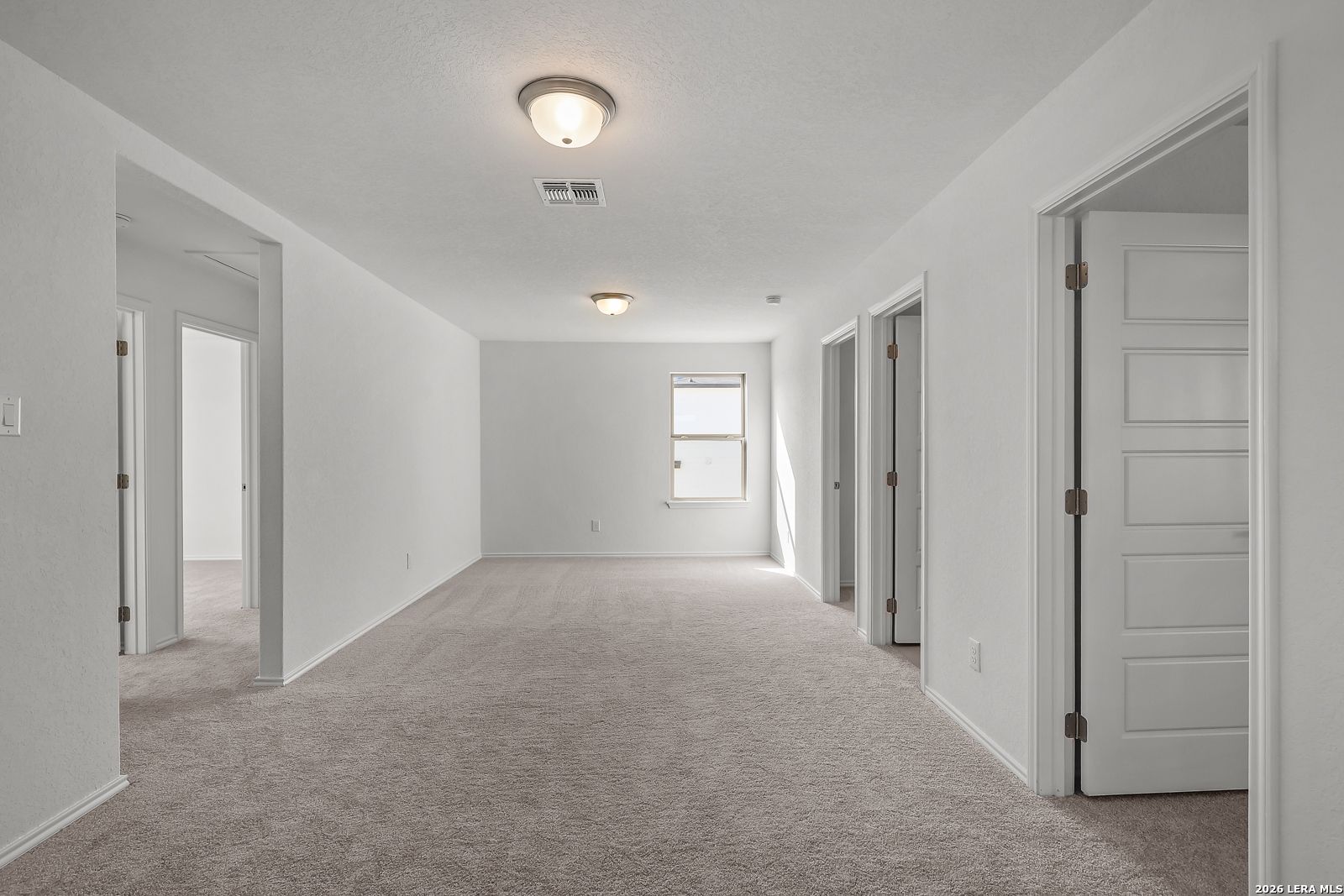 Spacious second-floor game room in The Brazos B floor plan by Davidson Homes in Agave, San Antonio, Texas.