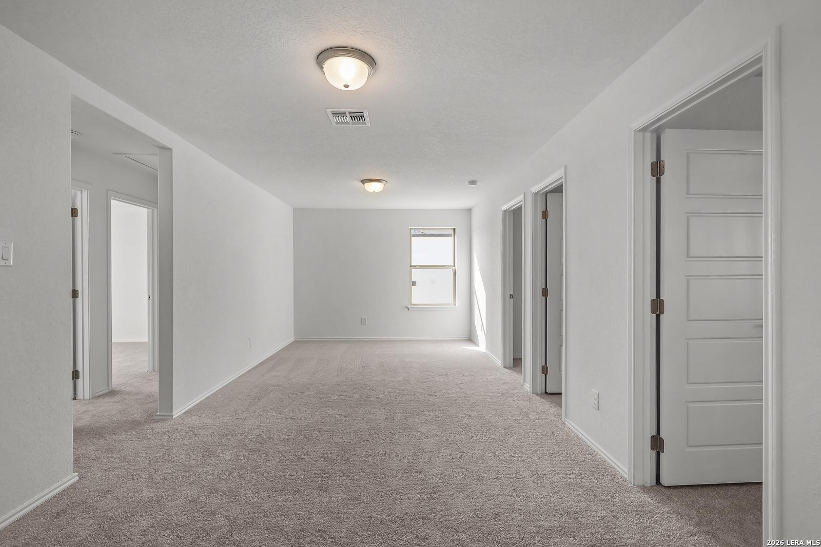 Spacious second-floor game room in The Brazos B floor plan by Davidson Homes in Agave, San Antonio, Texas.