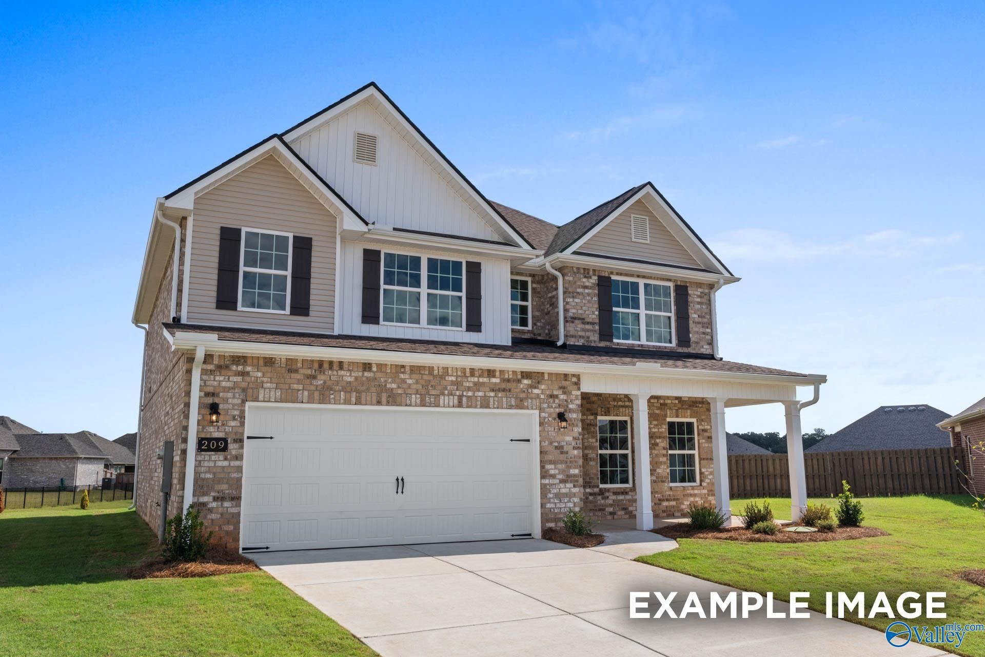 Modern two-story brick home with 2-car garage and covered porch in Heritage Lakes, New Market, Alabama