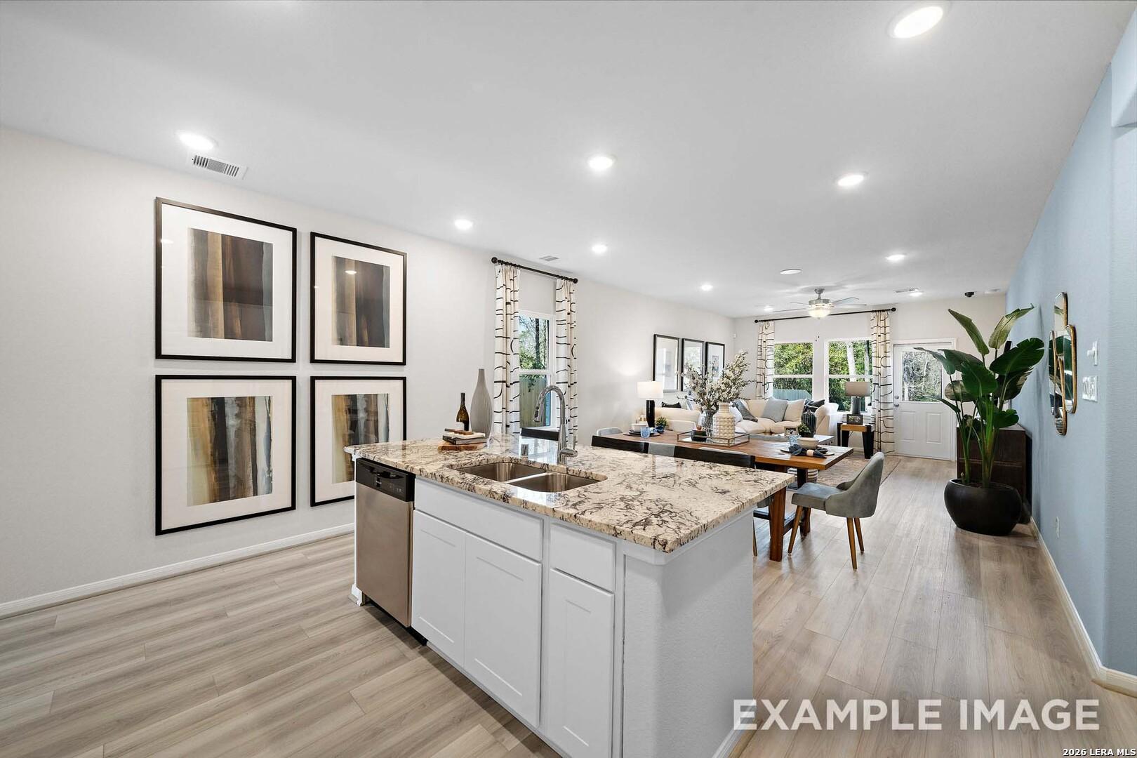 Open-concept kitchen and living area in San Marcos F floor plan by Davidson Homes, Rayburn Valley, San Antonio, Texas.