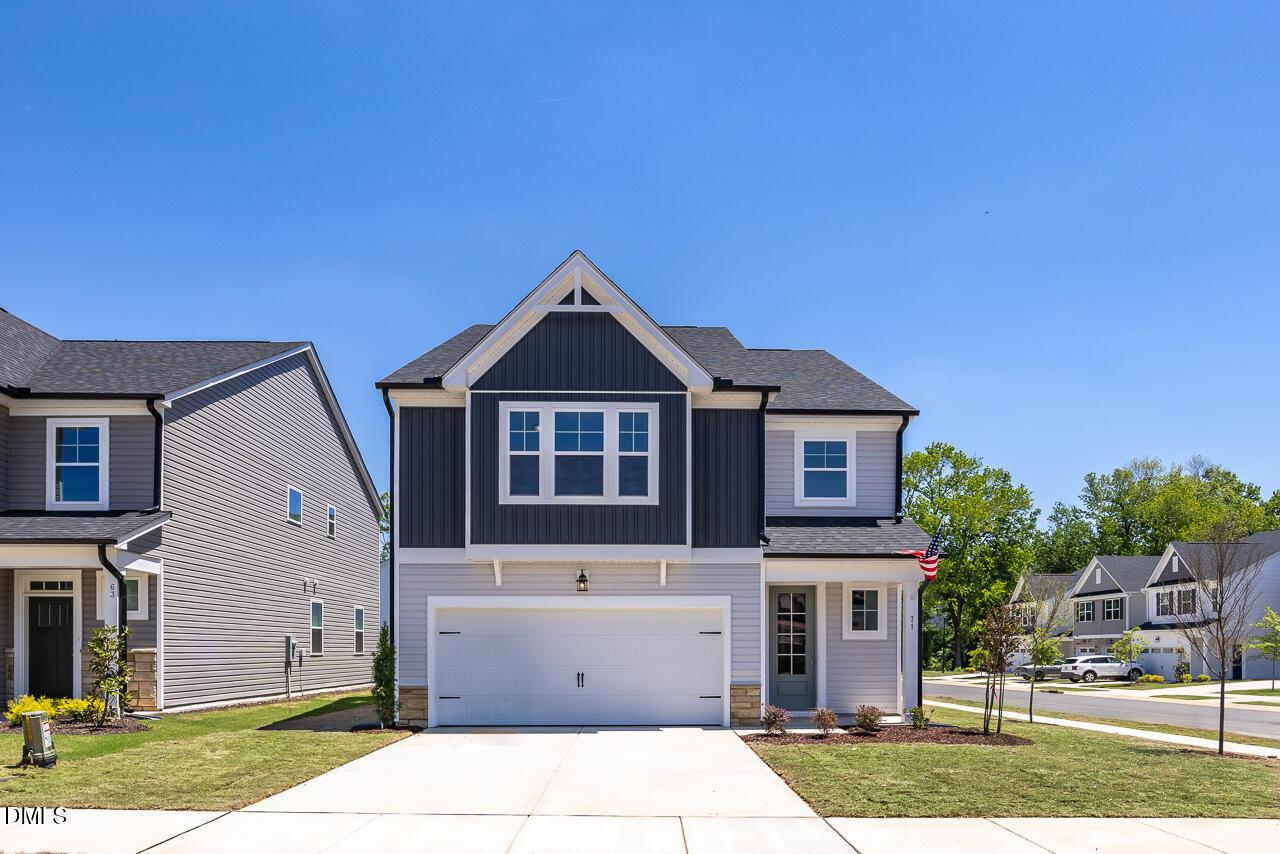 Two-story Adalynn B floor plan by Davidson Homes with a two-car garage in Gregory Village, Lillington, North Carolina.