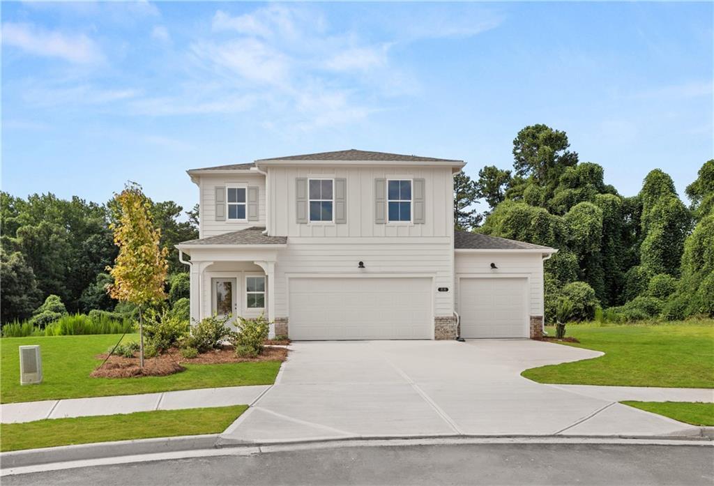 Two-story, 4-bedroom The Russell A floor plan by Davidson Homes with a 2-car garage in Cedar Farms, Winder, Georgia.