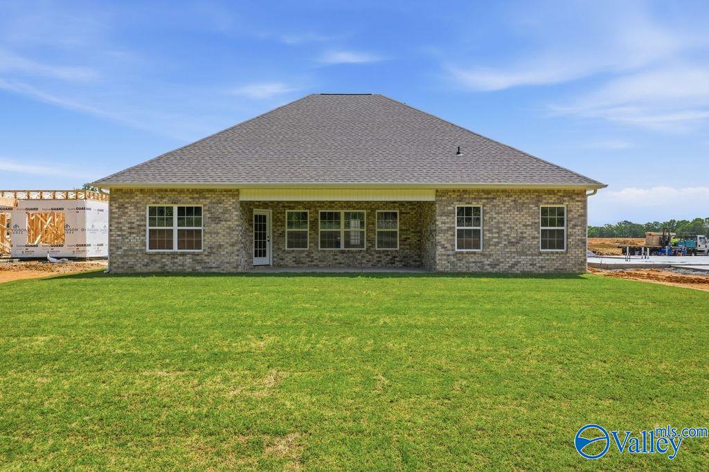 Rear brick exterior view of The Rockford with Bonus floor plan by Davidson Homes in Cain Park, Hartselle, Alabama.