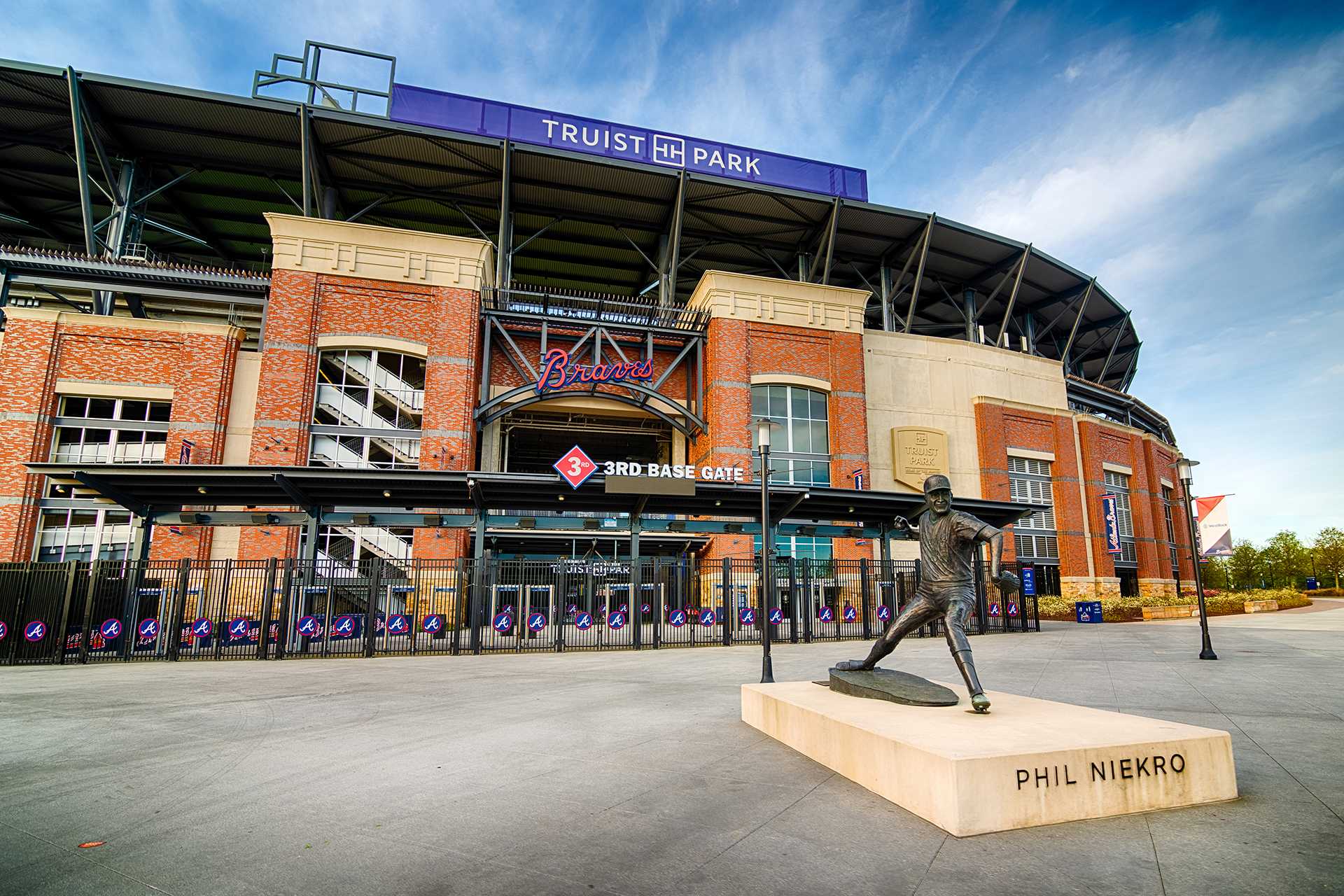 Truist Park Atlanta Braves stadium exterior featuring 3rd Base Gate and Phil Niekro bronze statue, Marietta GA area