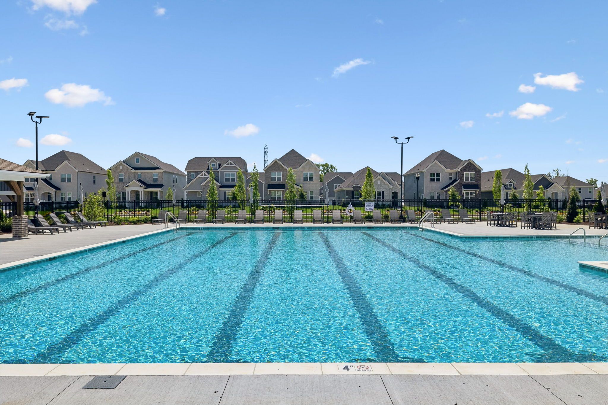 Community swimming pool at Bradshaw Farms in Mt. Juliet, Tennessee, featuring lap lanes and poolside lounge seating.