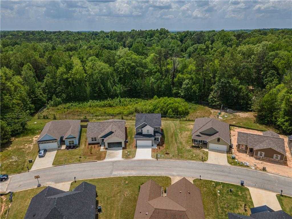 Aerial view of new 3-bedroom Bartlett homes with 2-car garages by Davidson Homes in wooded Summer Vineyard, Phenix City, AL