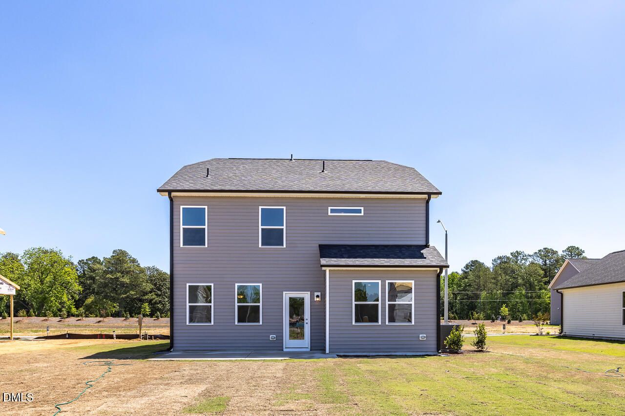 Rear exterior view of The Grace C floor plan by Davidson Homes at Retreat at North Main in Lillington, North Carolina.