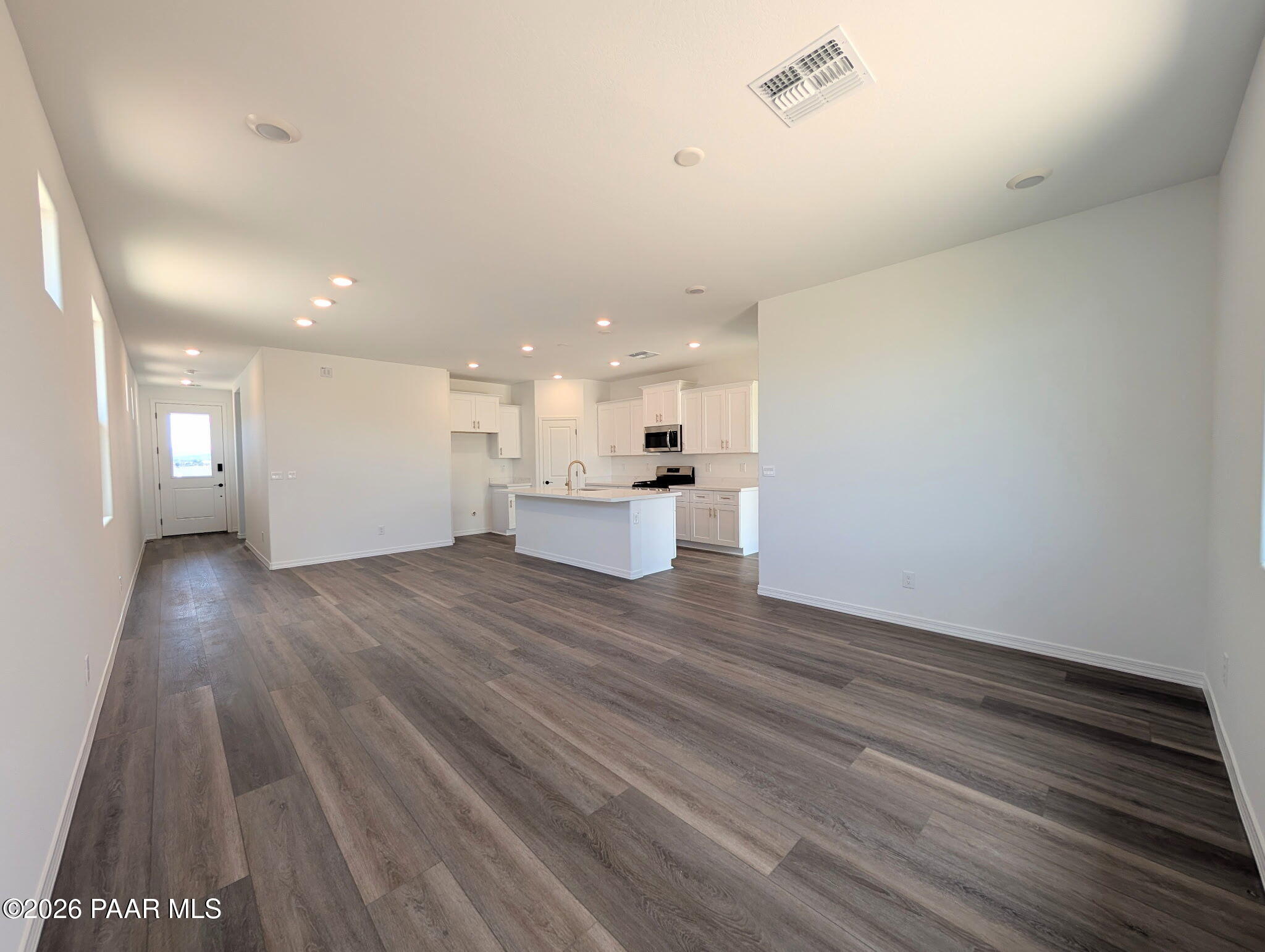 Open-concept kitchen and living area in The Frontier II F floor plan at South Ranch, Prescott, Arizona.