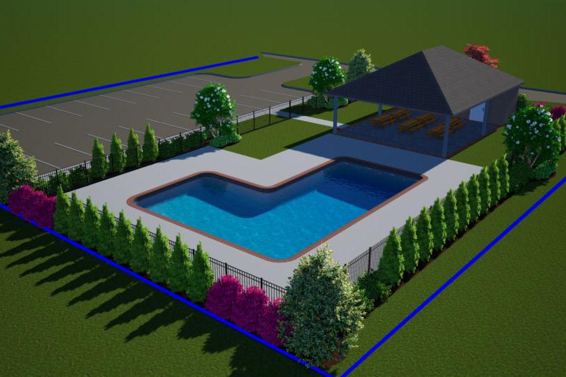 L-shaped community swimming pool at Kendall Downs in Toney, Alabama with pavilion, parking, and lush landscaping