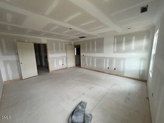 Unfinished spacious bedroom in The Hickory II C floor plan by Davidson Homes at Retreat at North Main in Lillington, NC.