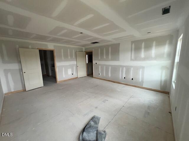 Unfinished spacious bedroom in The Hickory II C floor plan by Davidson Homes at Retreat at North Main in Lillington, NC.