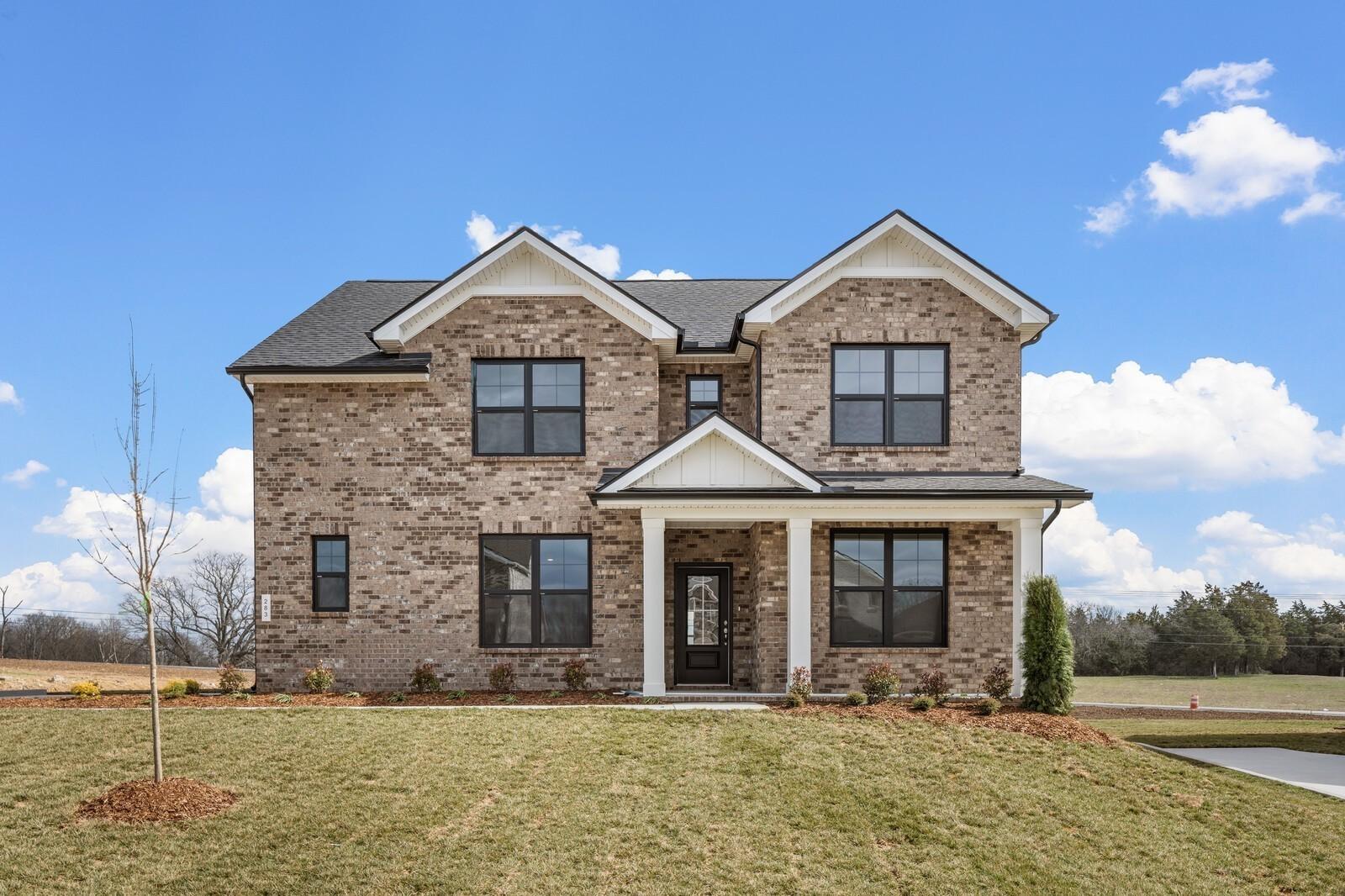 Two-story brick exterior of The Ridgeport D floor plan by Davidson Homes in Benders Cove, Mt. Juliet, Tennessee.