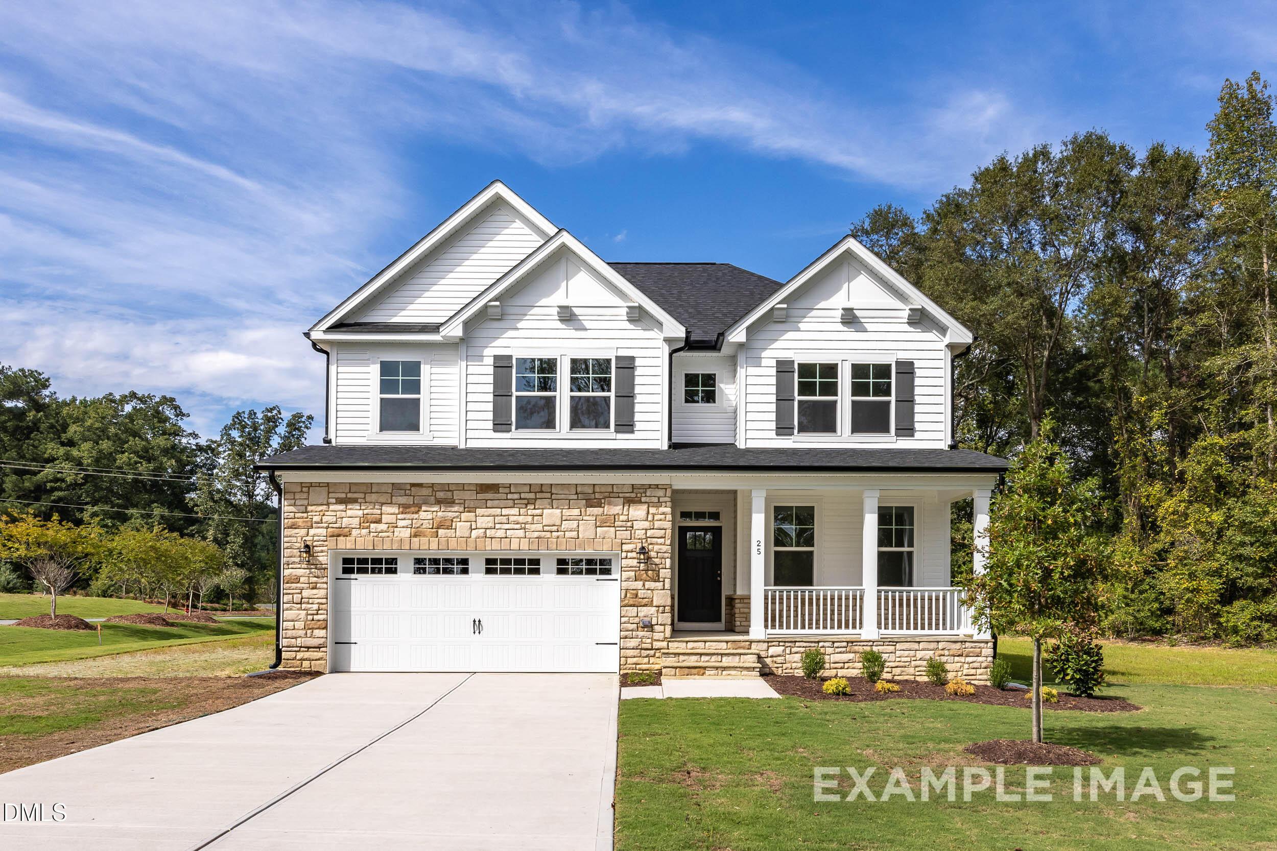 Two-story white Craftsman home with stone 2-car garage, covered porch, and landscaped yard in Wellers Knoll, Lillington, NC - Davidson Homes Willow D
