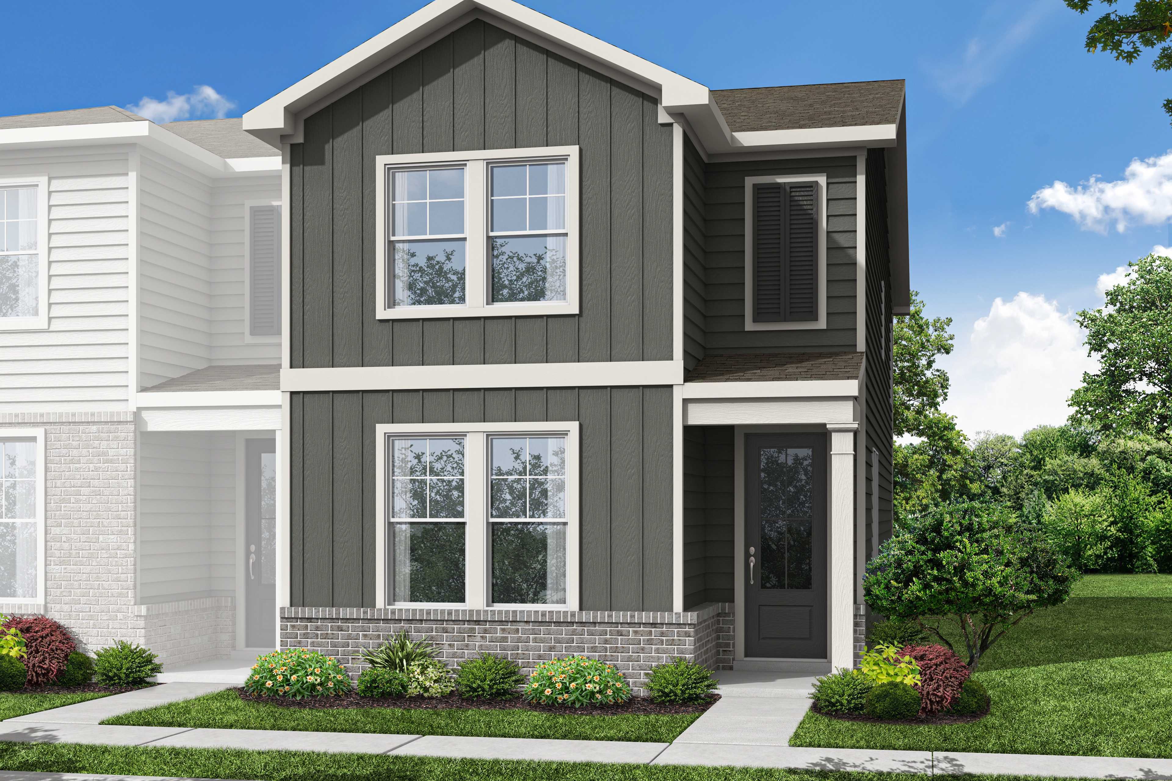 Two-story multi-family duplex The Monroe B with gray board-and-batten siding, white brick base, front porch, and landscaped yard in Emerson, Georgia