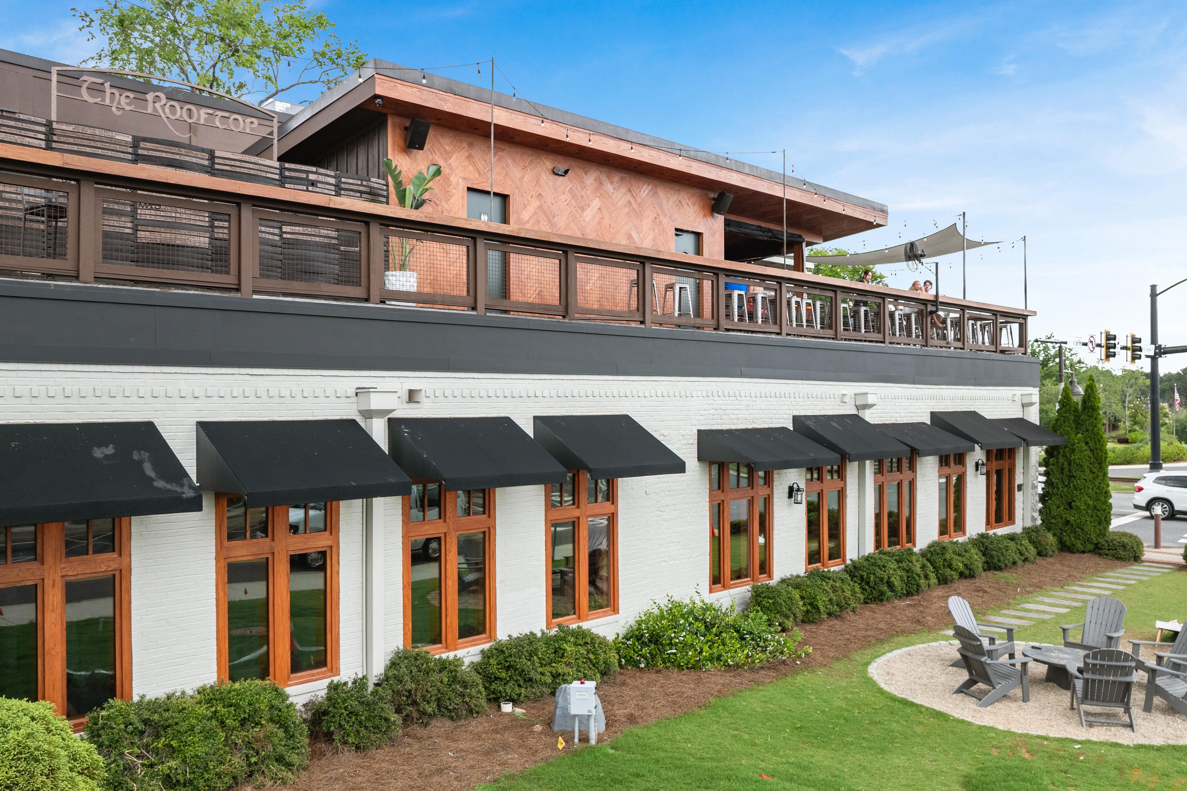 Rooftop lounge and outdoor fire pit area at Grafton Trace in Woodstock, Georgia by Davidson Homes.