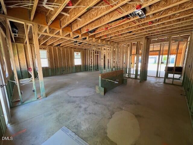 Open-concept wood framing of The Gavin A floor plan under construction in Gregory Village, Lillington, North Carolina.