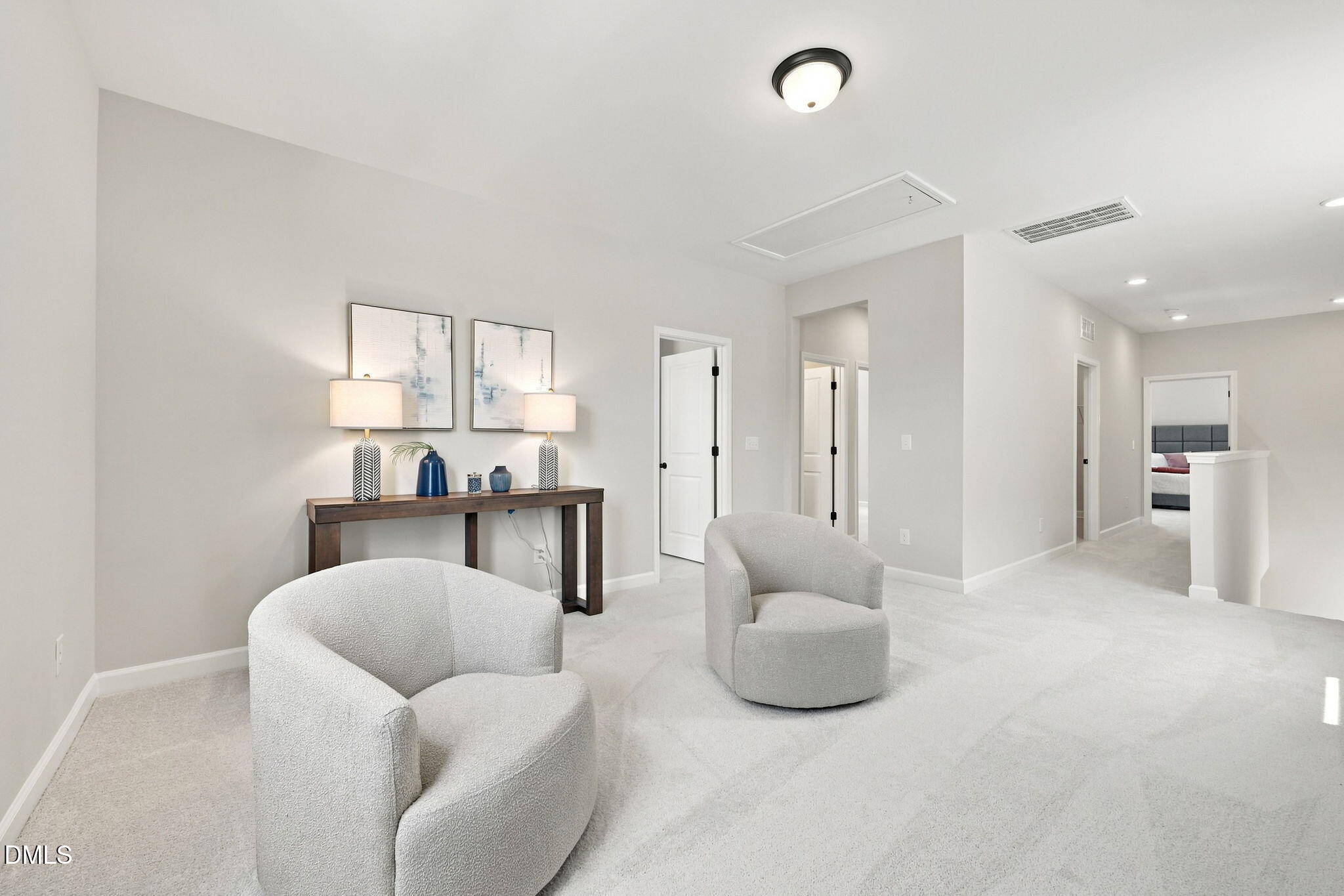 Spacious upstairs loft area with cozy seating in The Harris C floor plan by Davidson Homes in Forestville Yard, Knightdale.