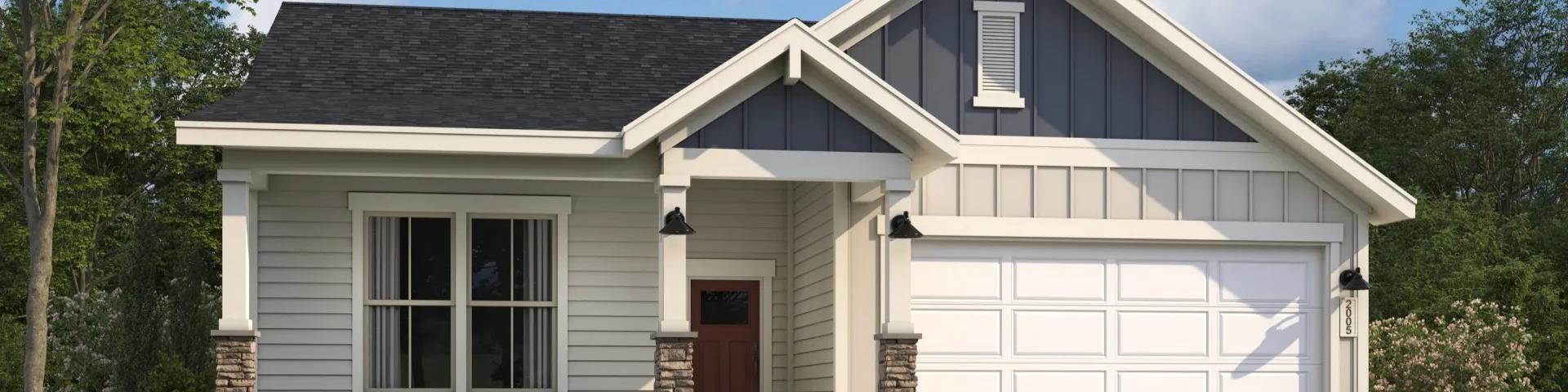 Modern craftsman ranch home exterior at Cape Reserve Donahue Ridge in Auburn Alabama with gabled roof stone accents and covered porch