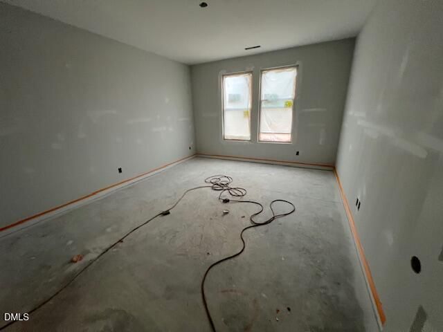 Unfinished bedroom under construction with bare drywall and concrete floor in Davidson Homes The Daphne C plan, Wellers Knoll, Lillington NC