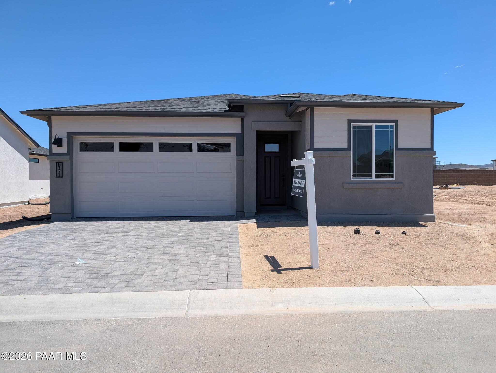 Single-story Frontier II F home by Davidson Homes with 2-car garage in South Ranch, Prescott, Arizona.