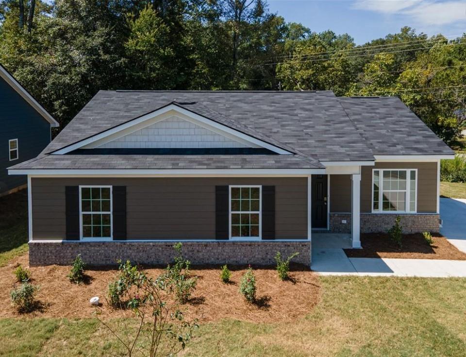 Modern 1-story gray home with white trim, black roof, and front porch in Summer Vineyard, Phenix City, Alabama - Davidson Homes Washington