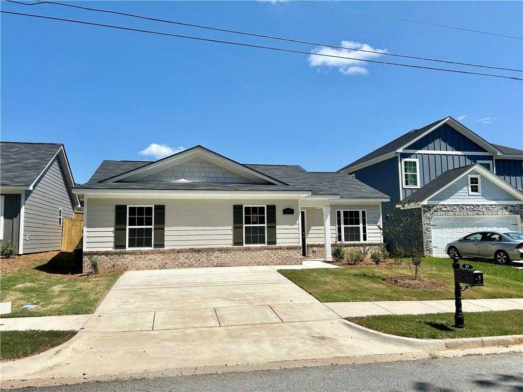 Modern 1-story 3-bedroom home with gray roof, white trim, attached garage, and driveway in Summer Vineyard, Phenix City, Alabama by Davidson Homes