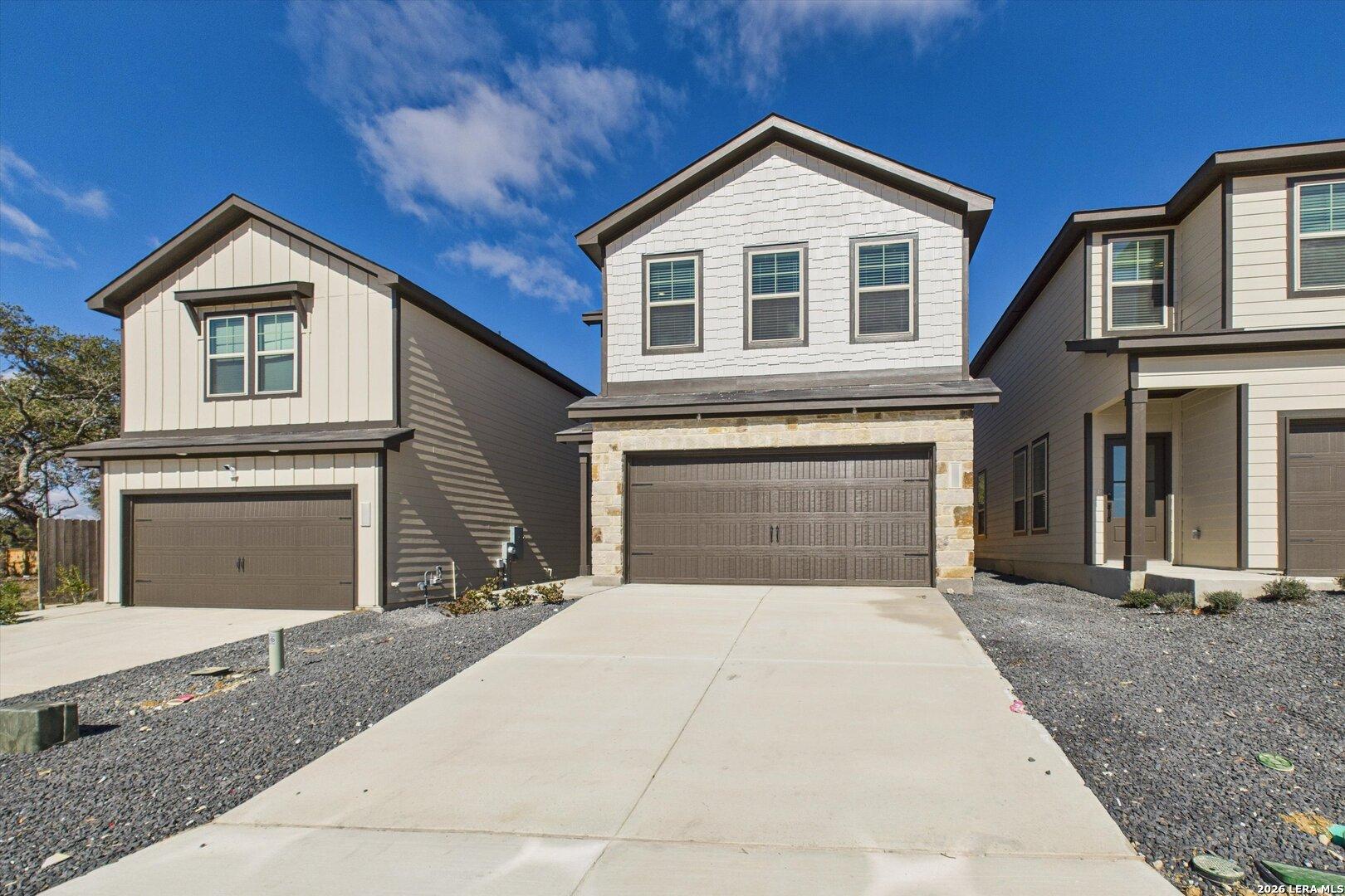 Modern two-story homes with 2-car garages and stone facades in Meadows at Oak Creek, San Antonio, Texas by Davidson Homes