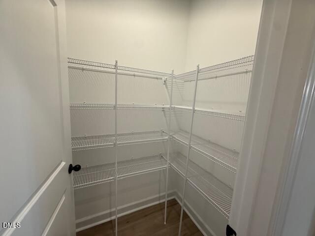 Walk-in pantry with white wire shelving in The Birch II A floor plan by Davidson Homes in Montrose, Aberdeen, NC.