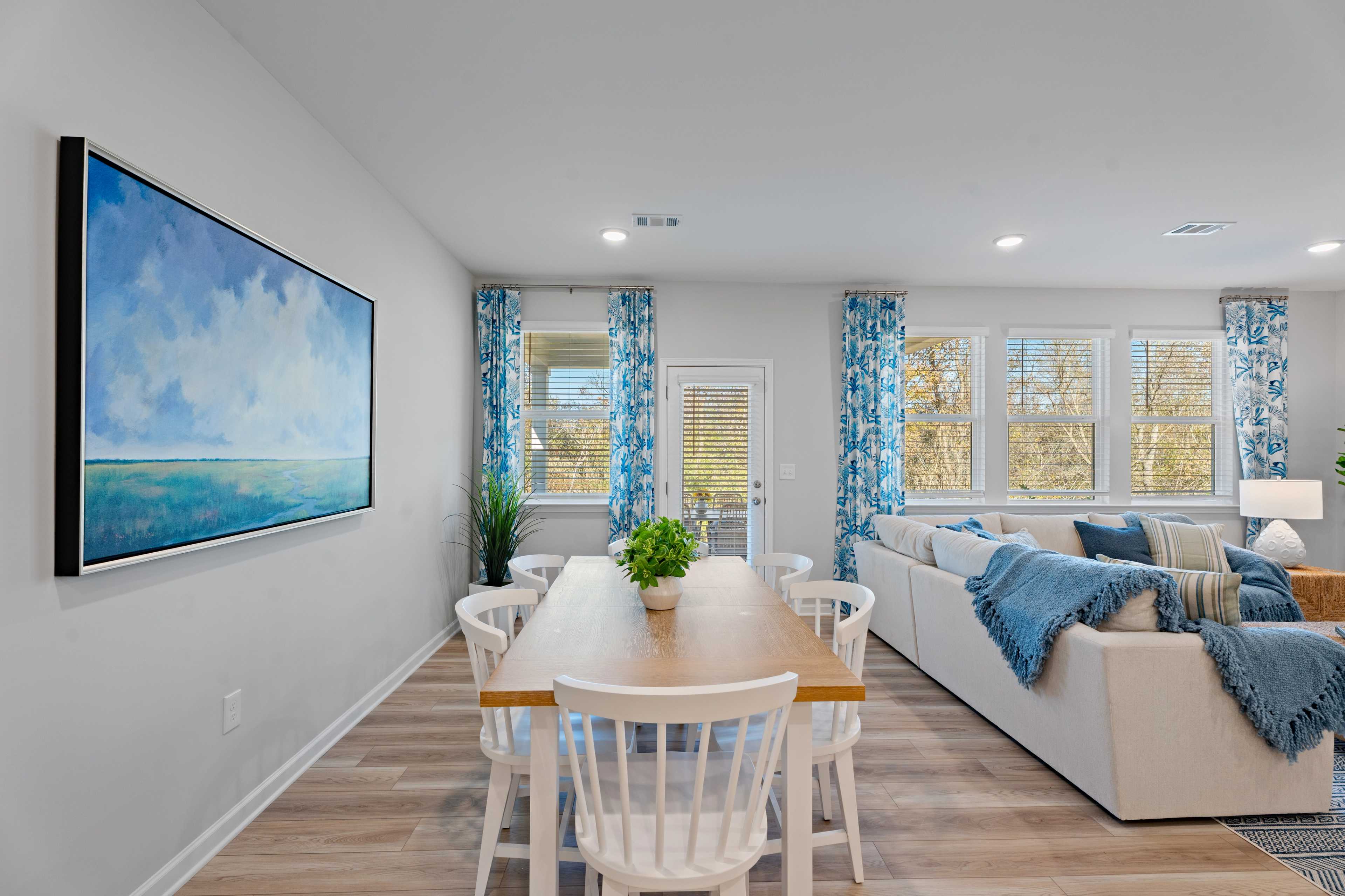 Dining room with wood table and white chairs