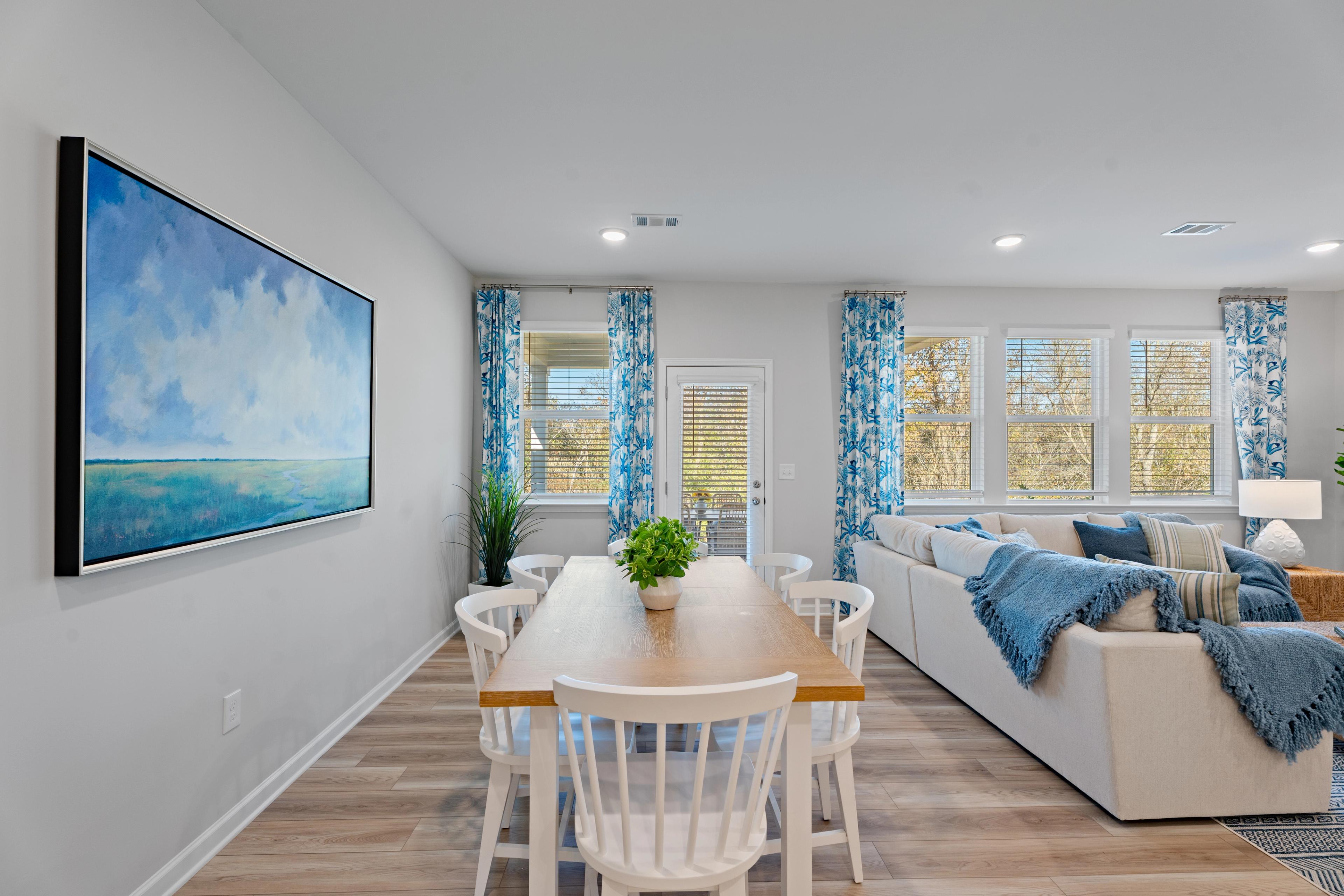Dining room with wood table and white chairs