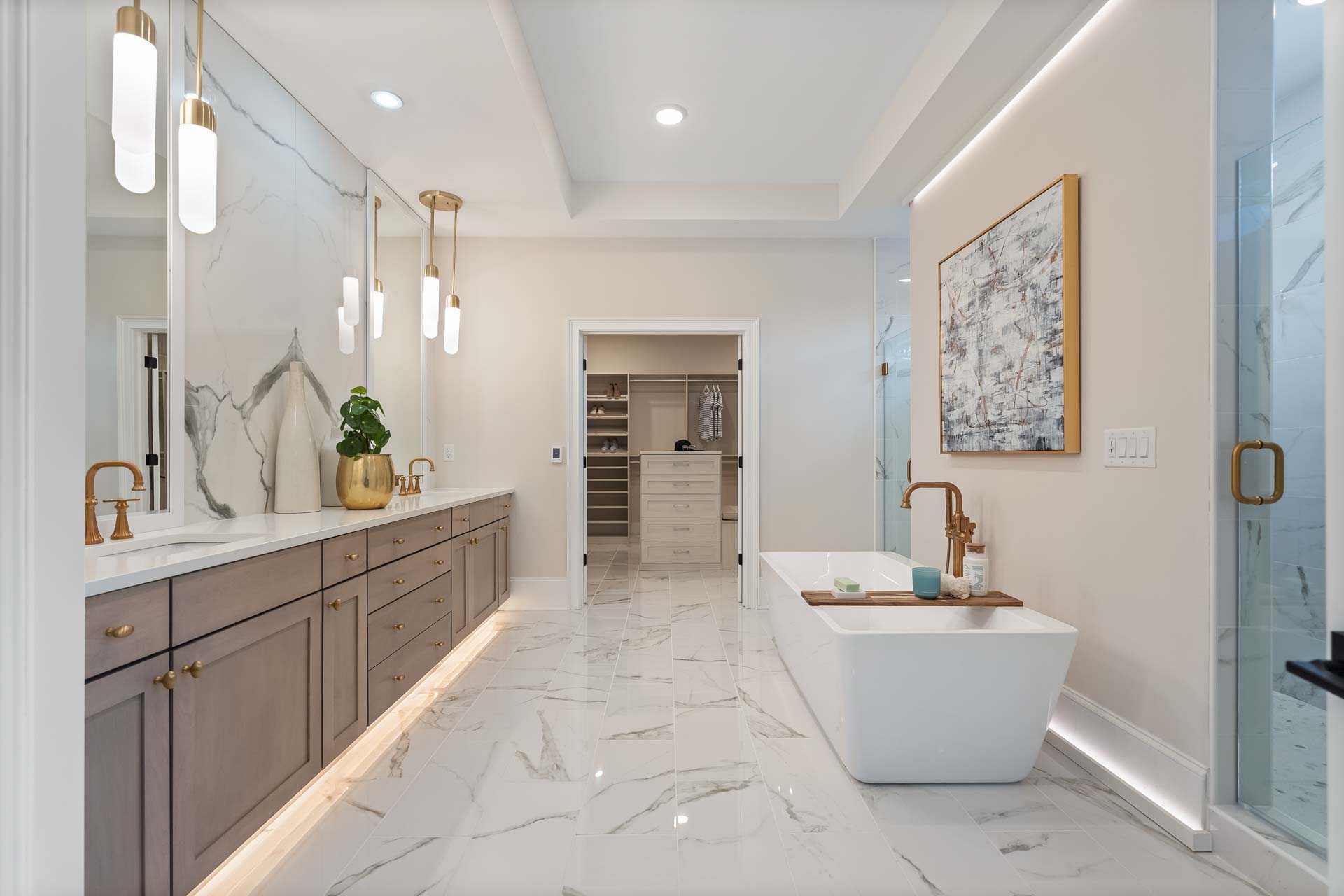 Luxurious master bathroom in Tanglewood East Cobb GA by Davidson Homes with freestanding tub, double vanity, marble tile floors and glass shower
