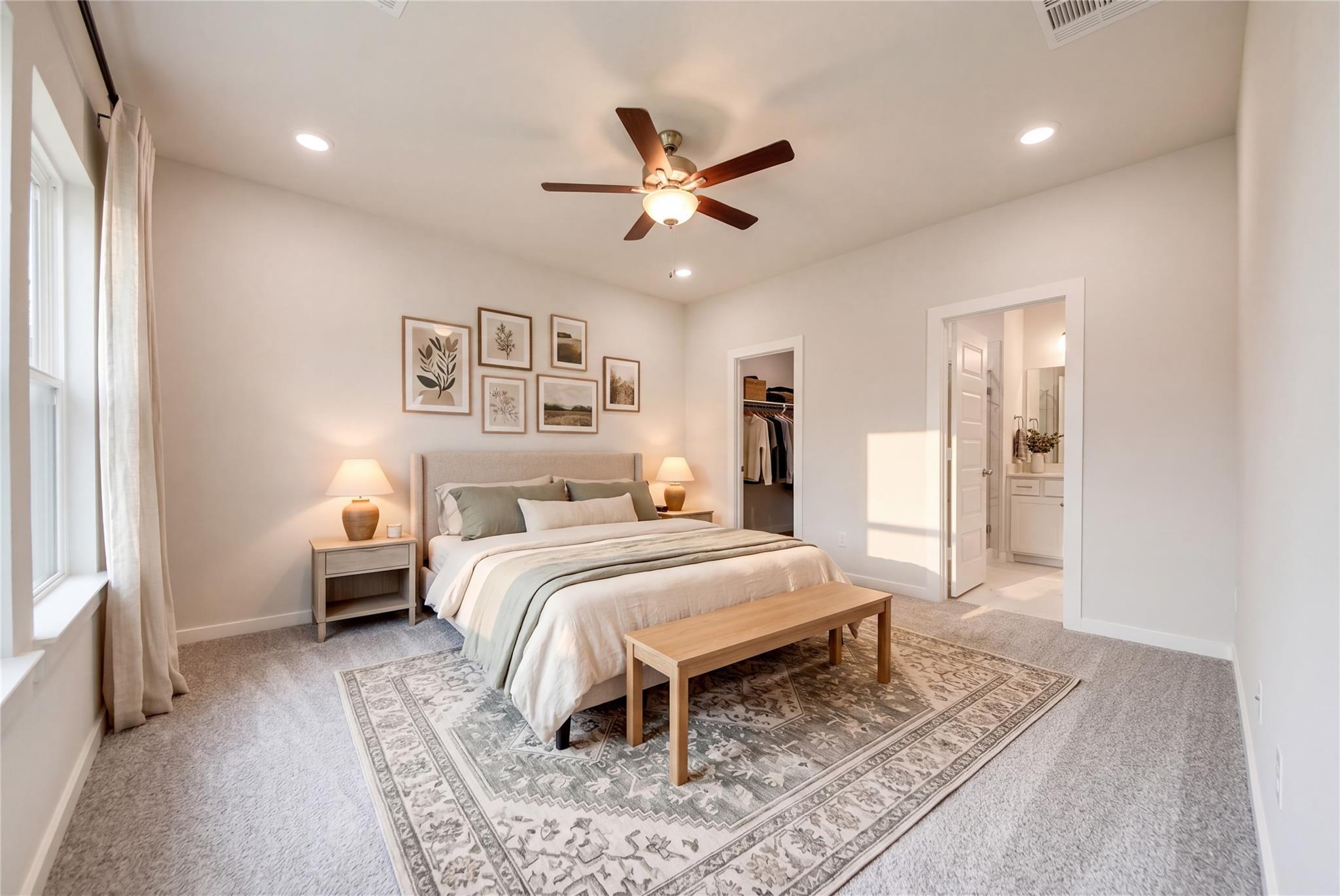Bright, cozy primary bedroom in The Sabine E floor plan by Davidson Homes at Windmill Estates in Magnolia, Texas.