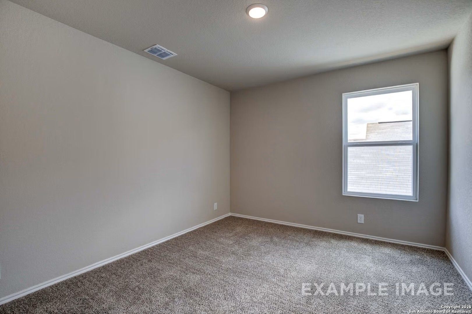 Empty secondary bedroom featuring beige walls, gray carpet, large window with blinds in Davidson Homes The Murray K, San Antonio
