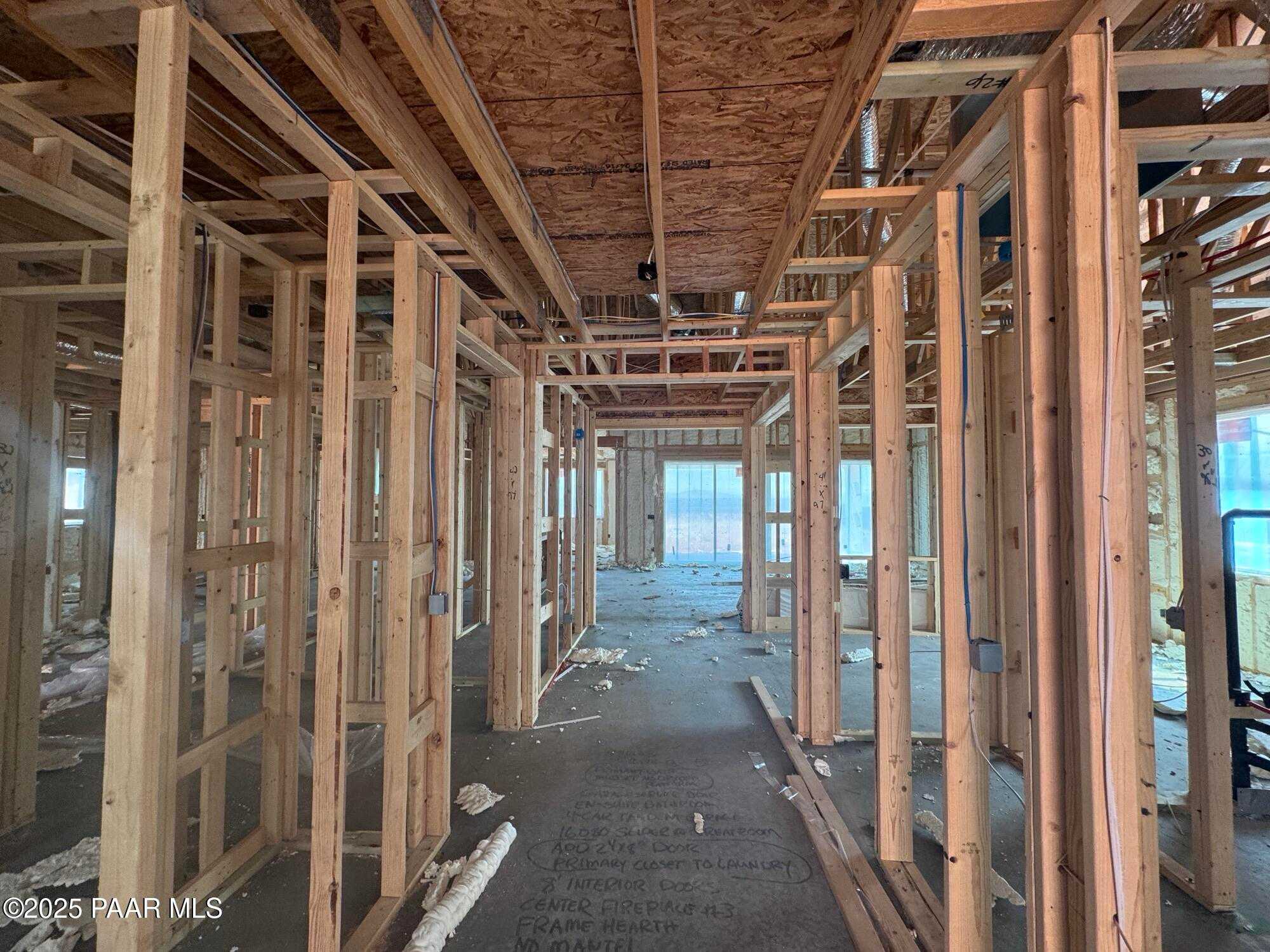 Exposed wooden framing in open hallway of 3-bedroom The Sunrise A home by Evermore Homes, Prescott Valley, Arizona