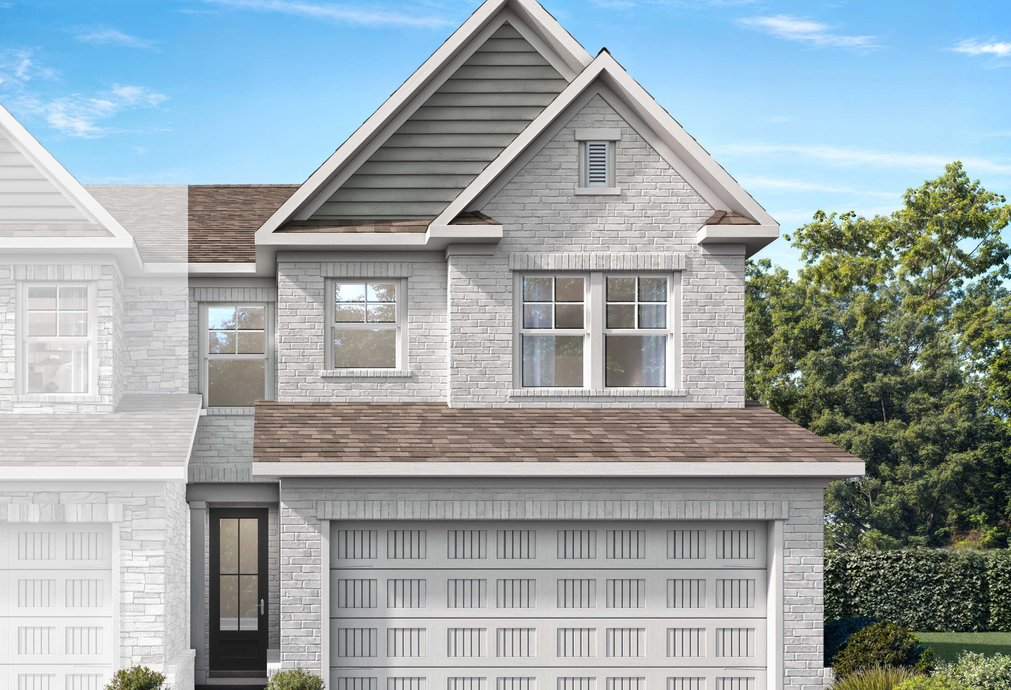 Two-story Cary A-LS brick home elevation with 2-car garage, shingled roof, and lush landscaping in Winder, Georgia