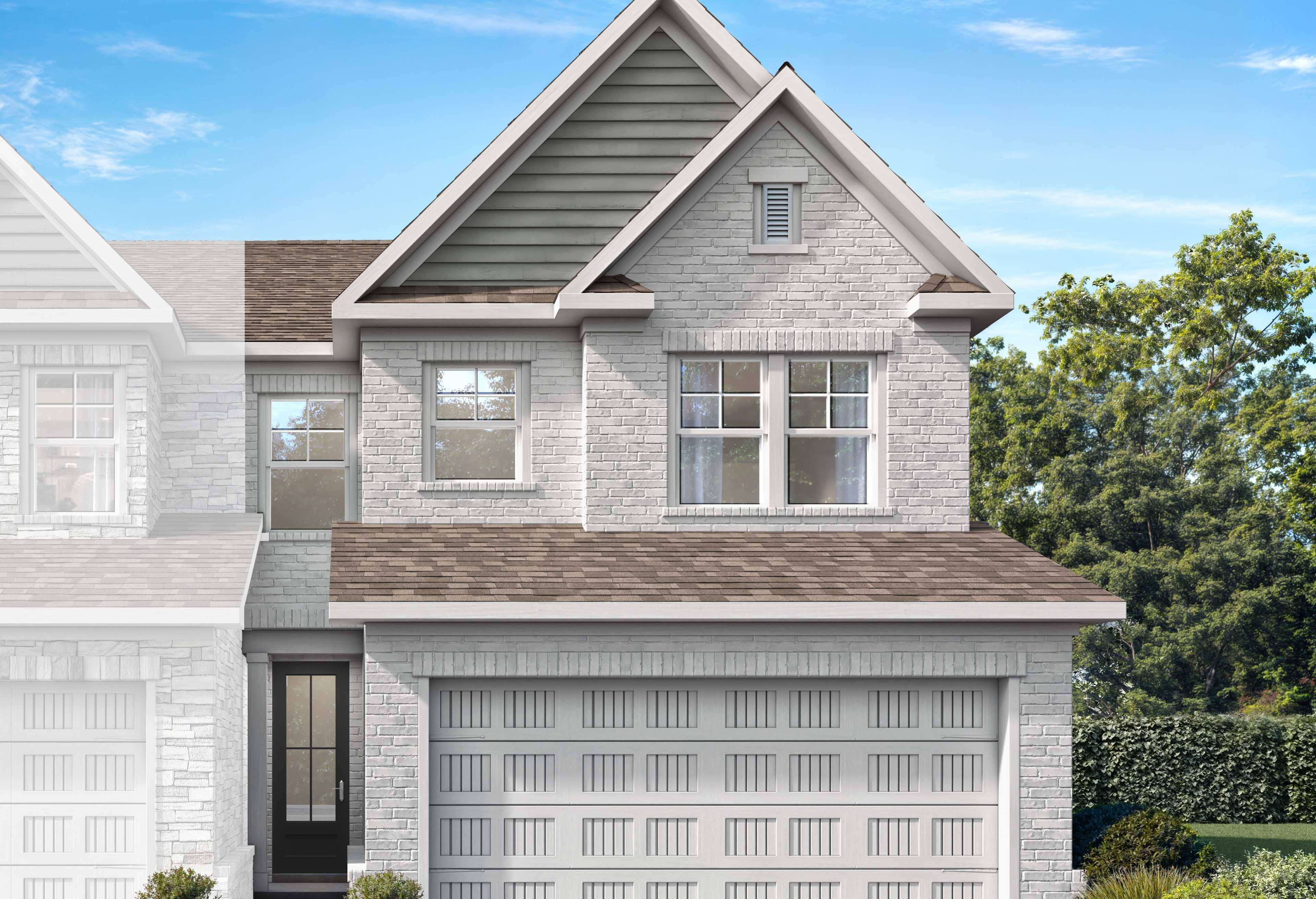 Two-story Cary A-LS brick home elevation with 2-car garage, shingled roof, and lush landscaping in Winder, Georgia