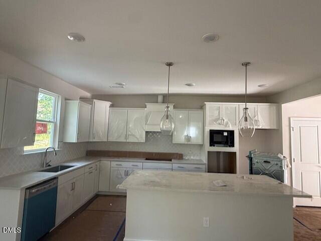 Modern kitchen with center island and white cabinetry in The Hickory II B floor plan by Davidson Homes in Montrose, NC.